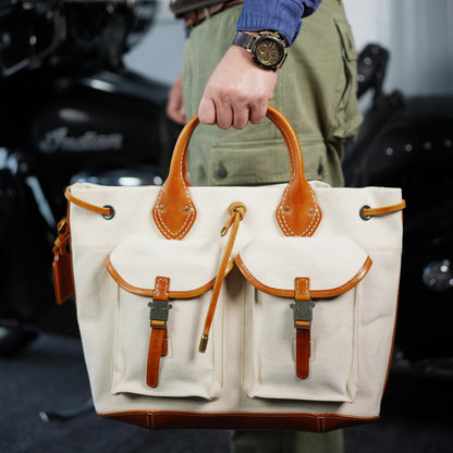 Large Canvas Leather Tote Bag with pockets, perfect for crossbody or shoulder wear.