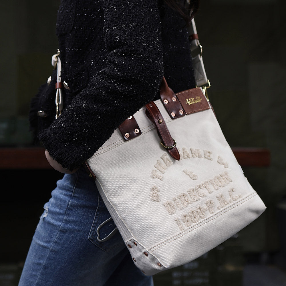 Canvas Leather Tote Bag 15.7in Retro Crossbody Workwear Unisex in army green worn by a model.