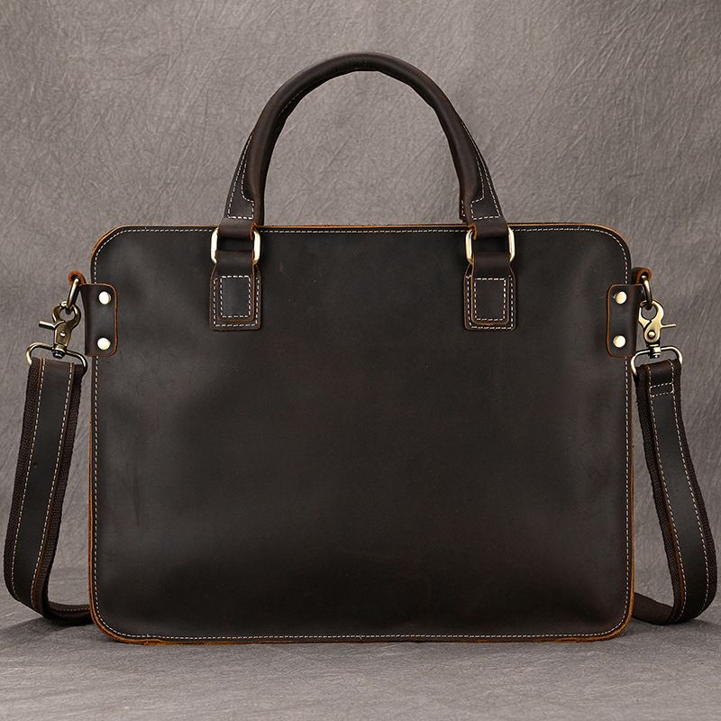 Dark brown full-grain leather 15 inch laptop briefcase with top handles, brass hardware, and detachable shoulder strap.