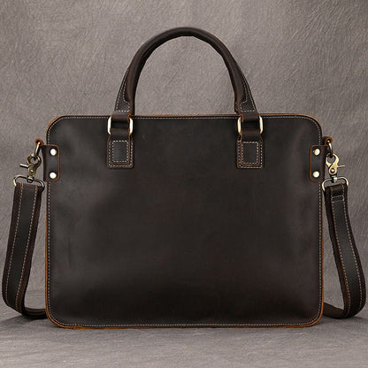 Dark brown full-grain leather 15 inch laptop briefcase with top handles, brass hardware, and detachable shoulder strap.