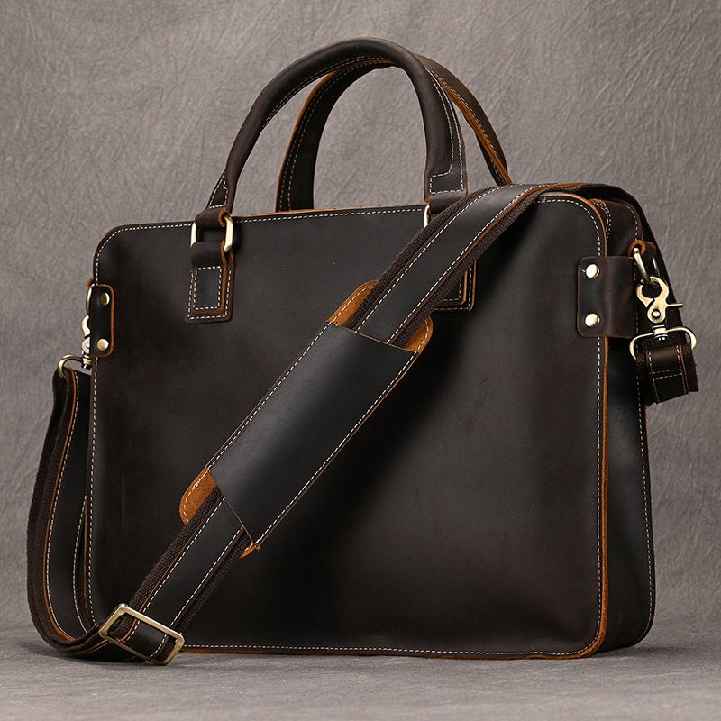 Heritage dark brown full-grain leather 15 inch laptop briefcase with handles and padded shoulder strap.