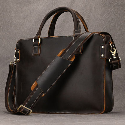 Heritage dark brown full-grain leather 15 inch laptop briefcase with handles and padded shoulder strap.