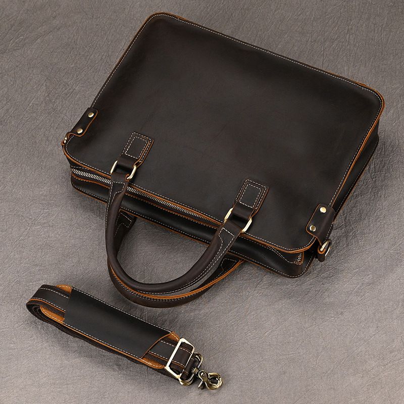 Dark brown full-grain leather 15-inch laptop briefcase with top handles and a detachable shoulder strap.