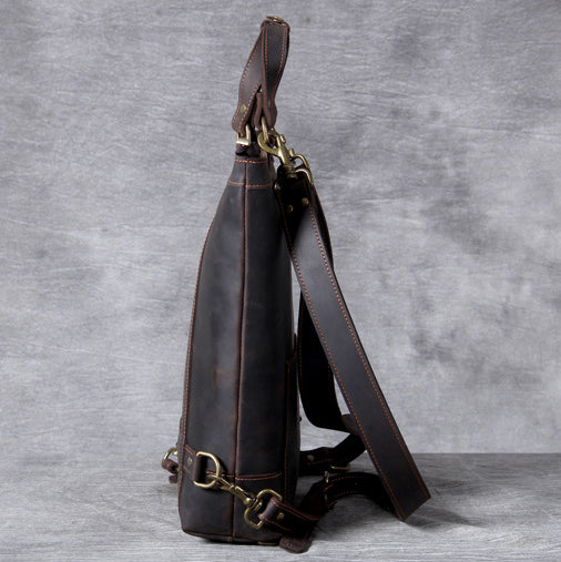 Side view of Full Grain Leather Backpack Tote 15in 3 Way Carry Laptop Bag Men with leather shoulder strap.