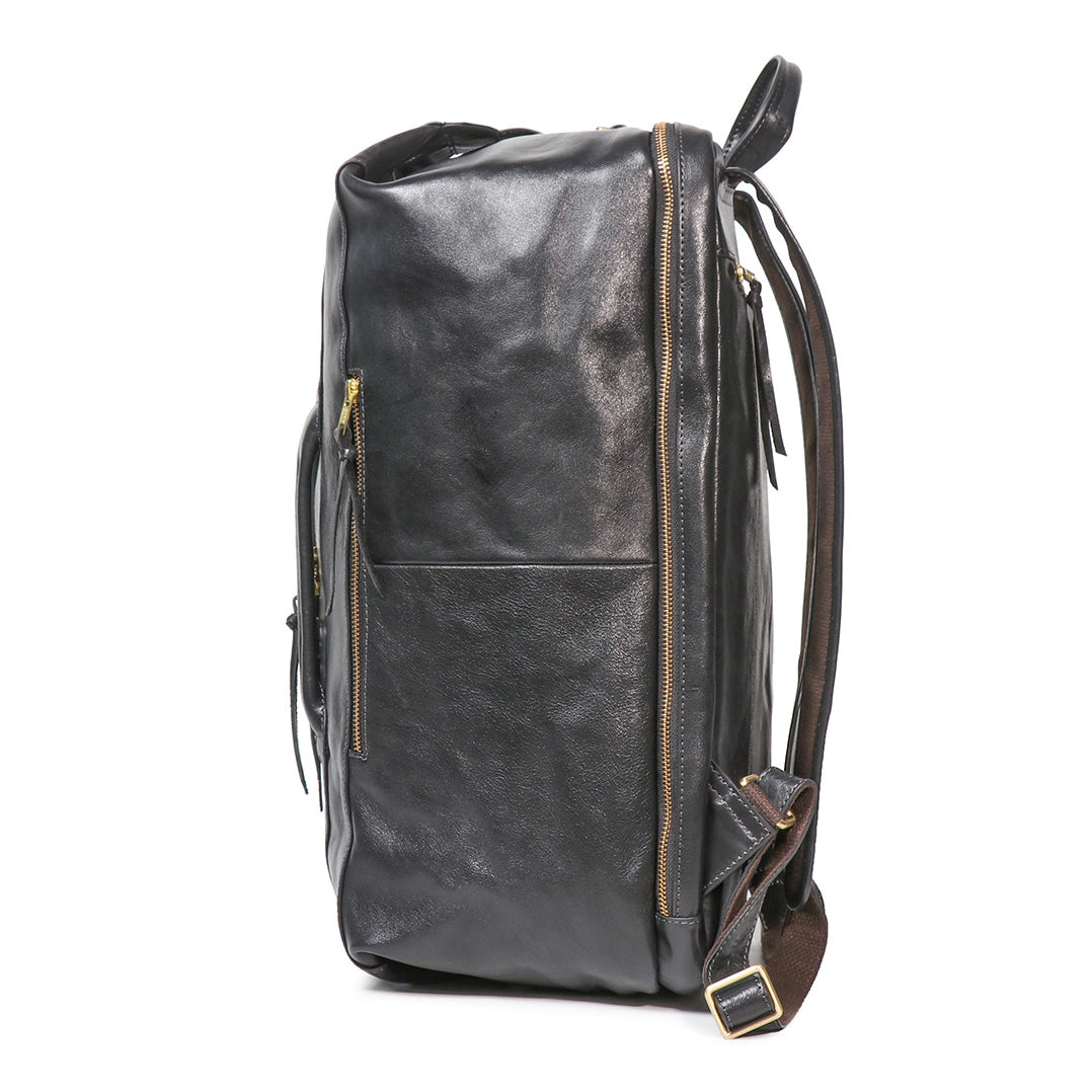 Side view of the Executive 18-Inch Full-Grain Leather Laptop Backpack in black with gold zippers and padded straps.