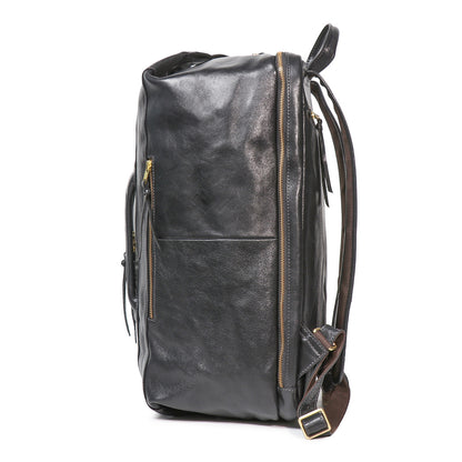Side view of the Executive 18-Inch Full-Grain Leather Laptop Backpack in black with gold zippers and padded straps.