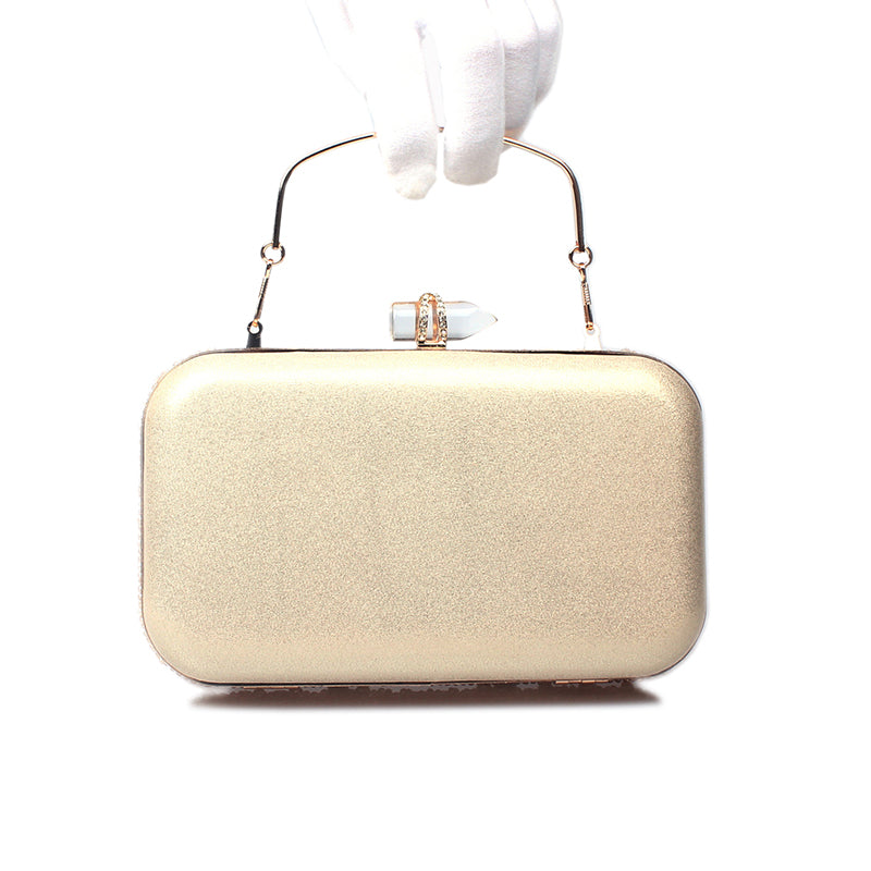 Gold Crystal Beaded Evening Clutch held by a gloved hand, showcasing its elegant gold finish and clasp.