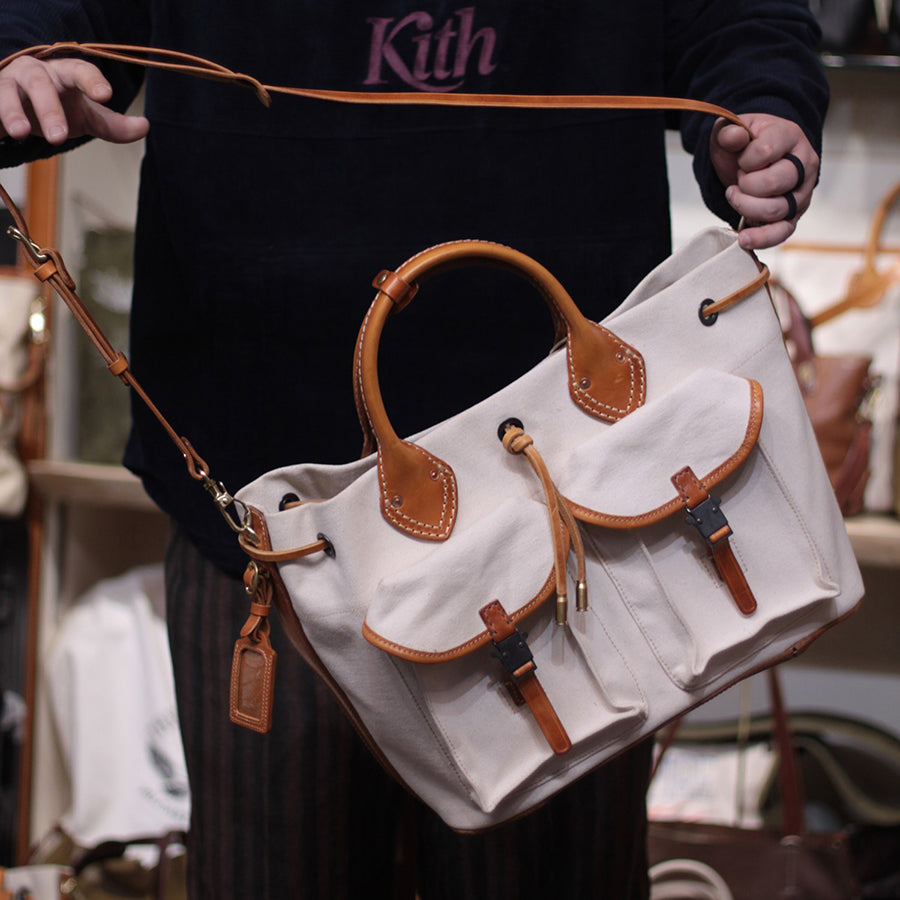 Large Canvas Leather Tote Bag with pockets, 19.7in vintage crossbody shoulder bag being held.