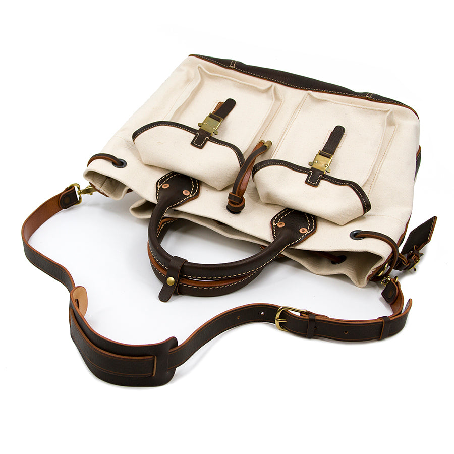 Large Canvas Leather Tote Bag showing front with pockets and adjustable shoulder strap.