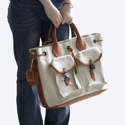 Large Canvas Leather Tote Bag with pockets, perfect for crossbody or shoulder carry, stylish and functional.