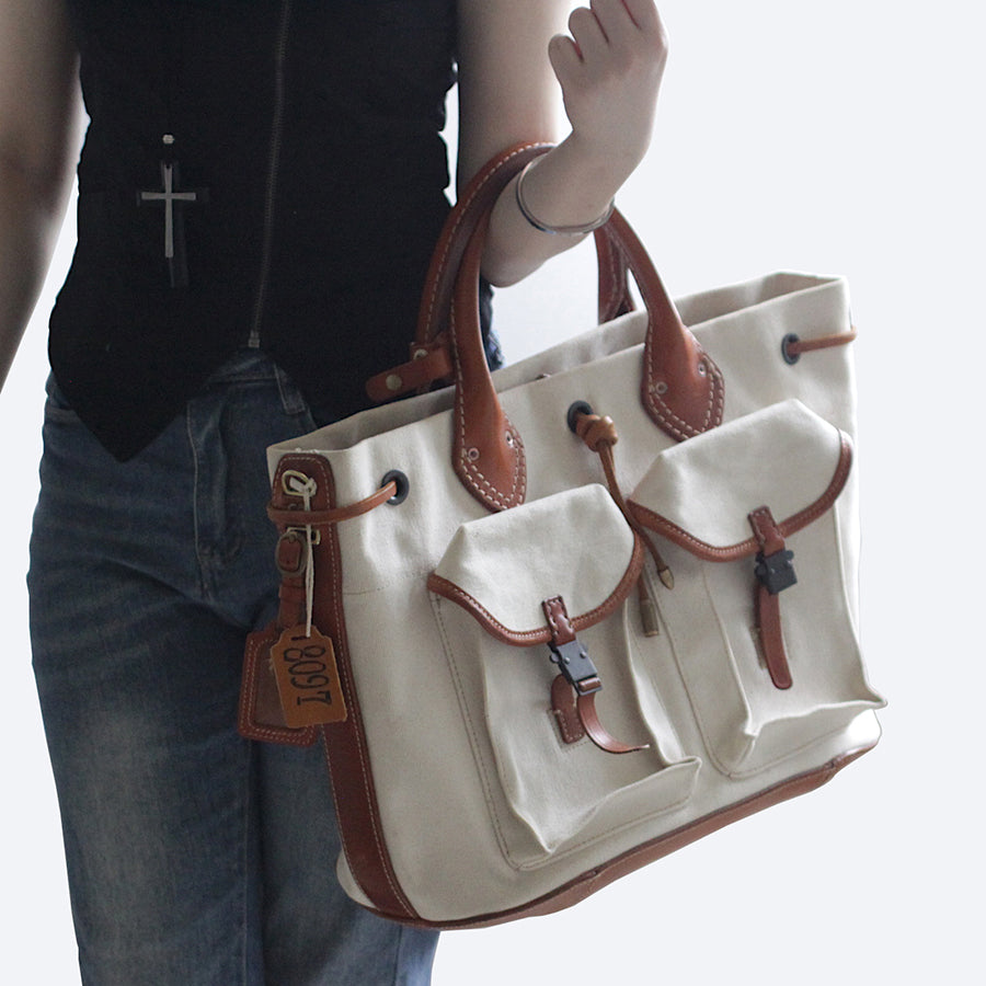 Large Canvas Leather Tote Bag featuring vintage design and multiple pockets, perfect for everyday use.