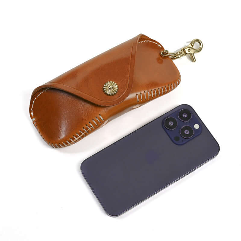 Italian Leather Glasses Case Handmade Vintage Sunglasses Holder next to a smartphone.