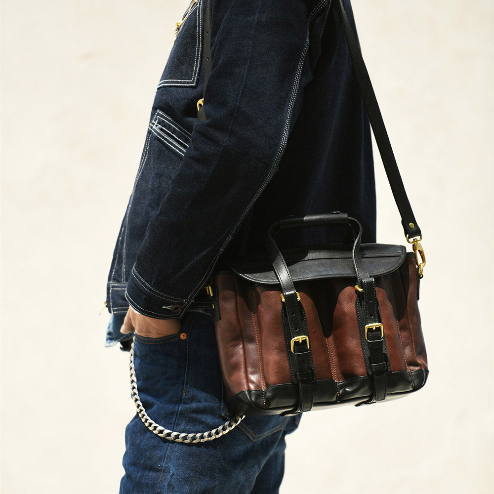 Italian Leather Messenger Bag 15.4in Cambridge Style Work Bag worn by a person, showcasing dark brown and black design.