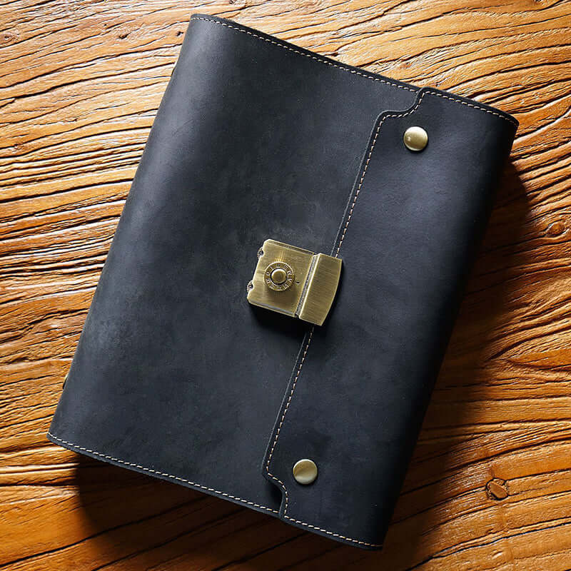 Refillable Leather Planner A5 With Lock Business Organizer 9in in black leather on wooden surface.