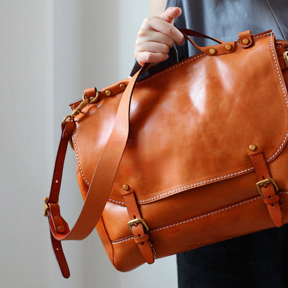 Leather Messenger Bag 13.8in Laptop Briefcase Crossbody Unisex being held by a person.