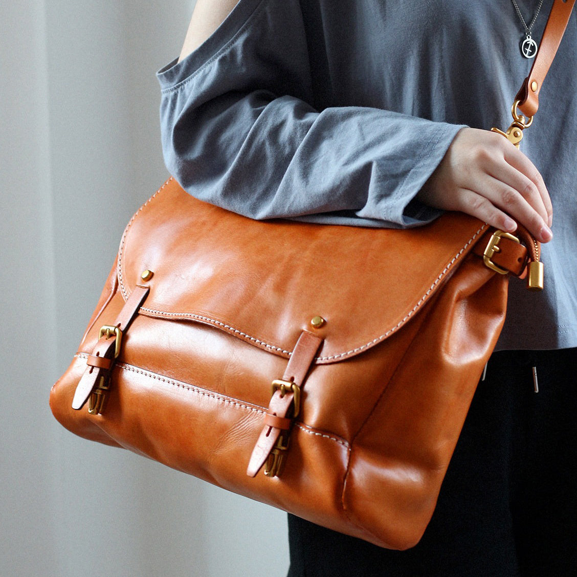 Leather Messenger Bag 13.8in Laptop Briefcase Crossbody Unisex in yellow brown leather, carried over the shoulder.