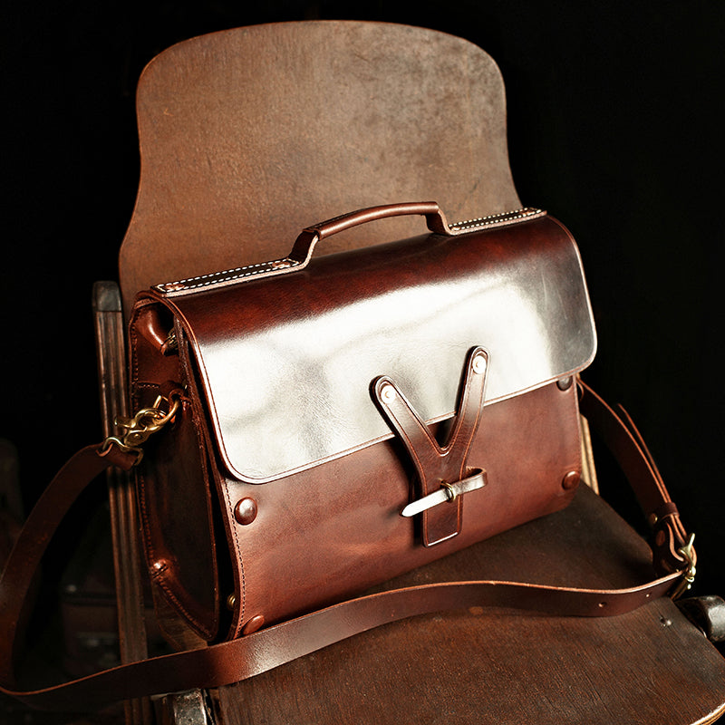 Handmade Italian Leather Laptop Bag Men 15in Convertible Briefcase on a wooden chair.