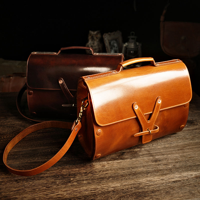Handmade Italian Leather Laptop Bag Men in brown and tan colors on a wooden surface.