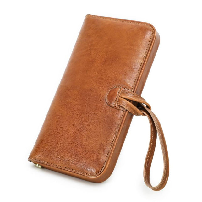 Leather Wristlet Wallet Women Clutch Metal Frame Phone Holder Purse in brown with wrist strap.