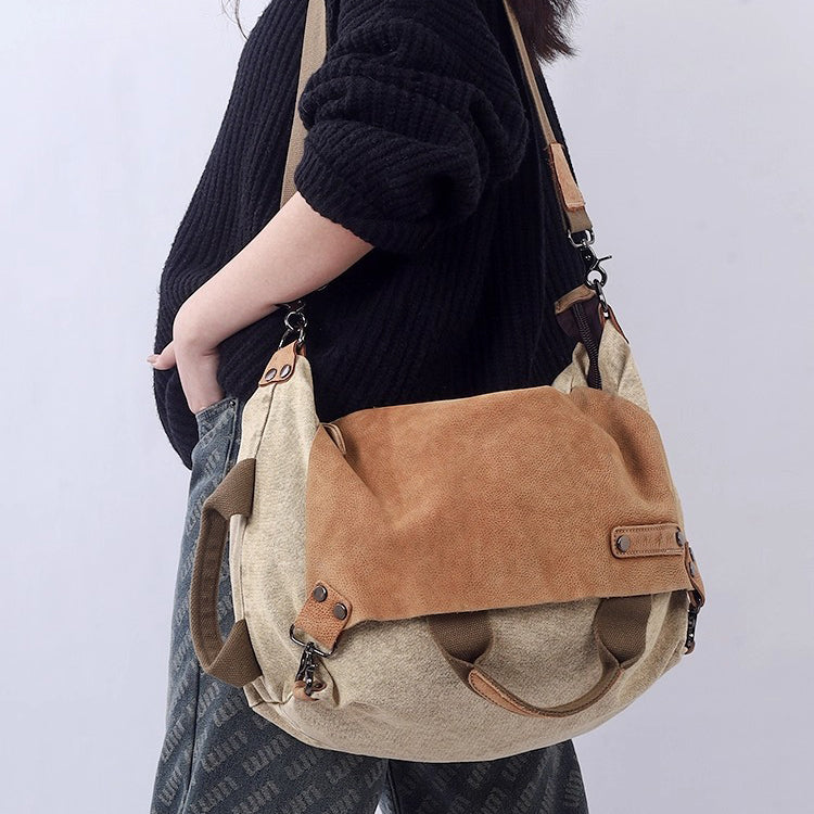 Woman carrying a soft leather canvas weekend bag, showcasing its stylish design and versatile use.