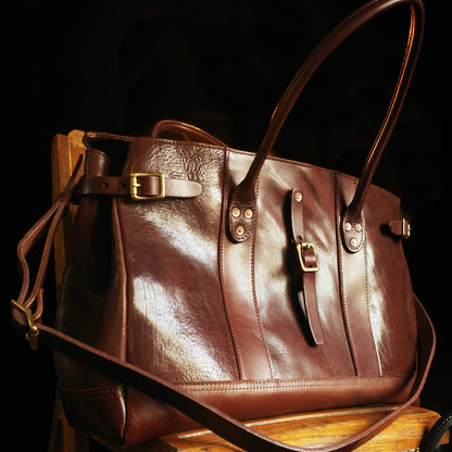 Italian Leather Travel Bag 17.7in Large Laptop Tote Weekender Briefcase in rich brown leather on a wooden surface.