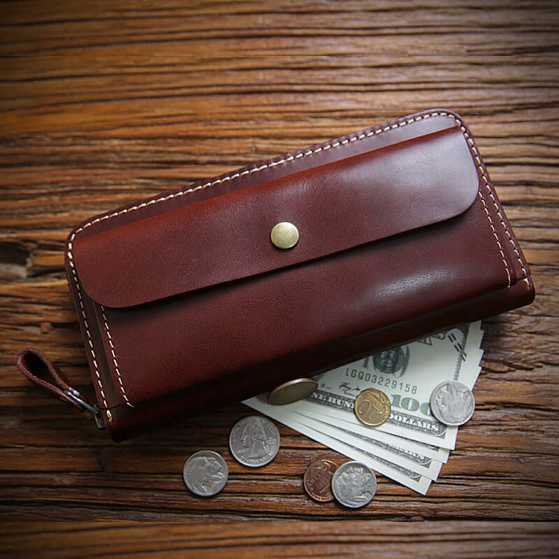 Full Grain Leather Zip Around Wallet Card Holder Phone Organizer on a wooden surface with coins and cash.
