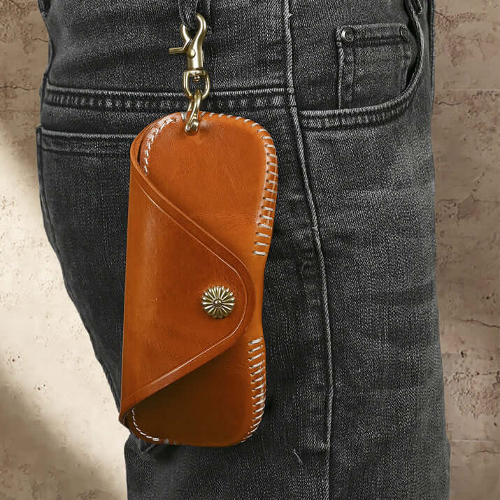 Italian Leather Glasses Case Handmade Vintage Sunglasses Holder hanging from a belt loop in a stylish brown leather design.