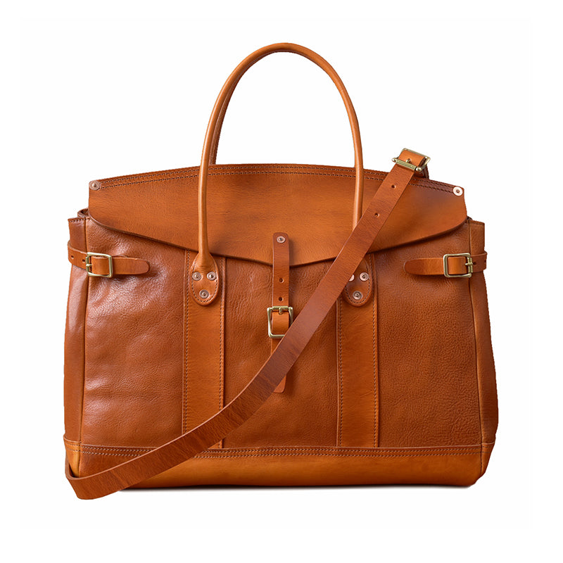 Italian Leather Travel Bag in rich brown color, featuring dual handles and adjustable strap, perfect for business travel.