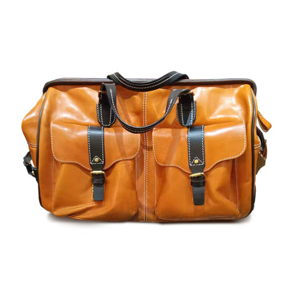 Handmade Leather Travel Bag With Wheels, brown leather duffel with pockets and sturdy handles.