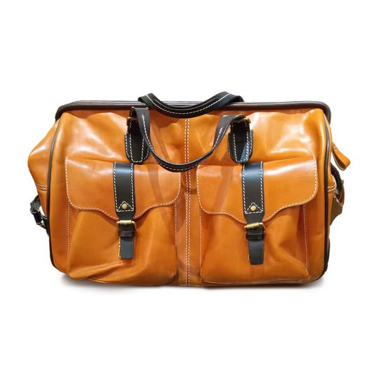 Handmade Leather Travel Bag With Wheels, brown leather duffel with pockets and sturdy handles.