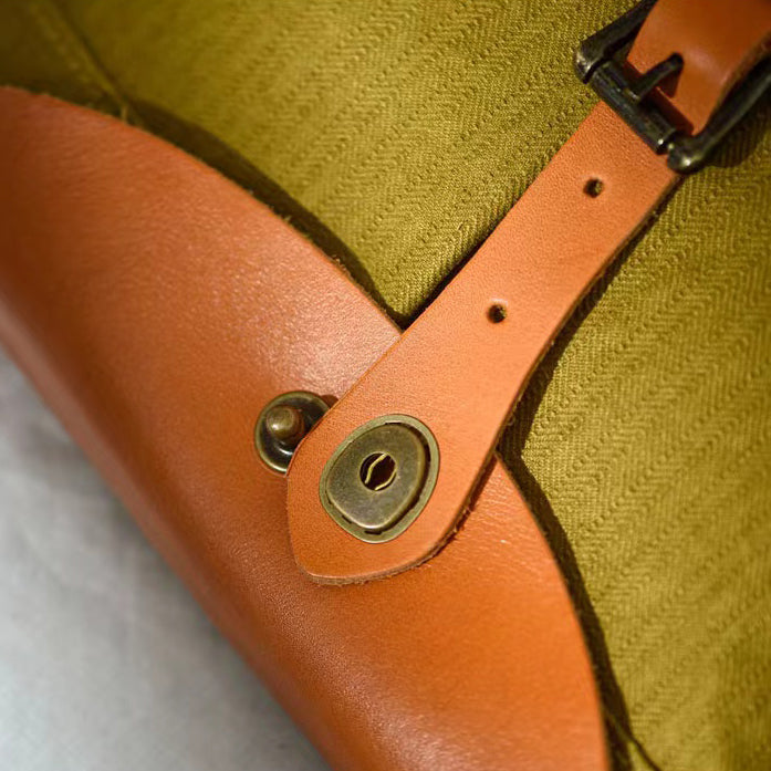 Saddle style canvas leather bag